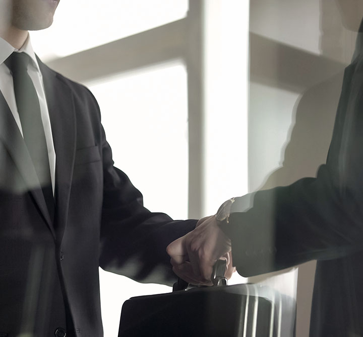 Man in suit holding a briefcase