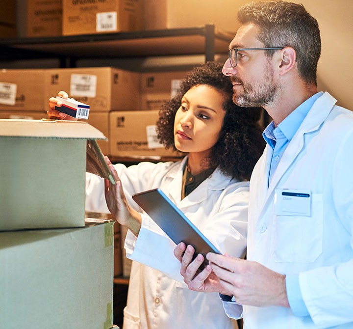 Associates viewing temperature monitor in a storage room