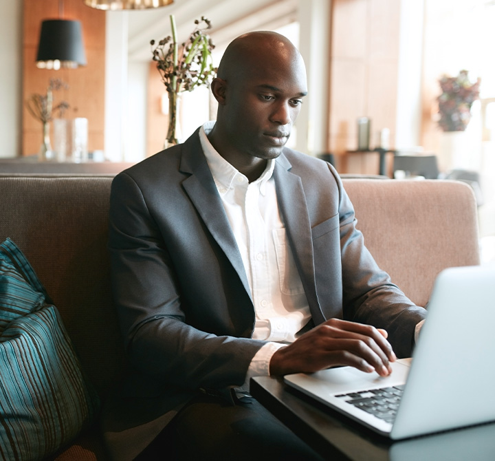 Man sitting at laptop in remote location
