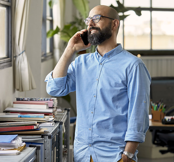 Man talking on cell phone while smiling 