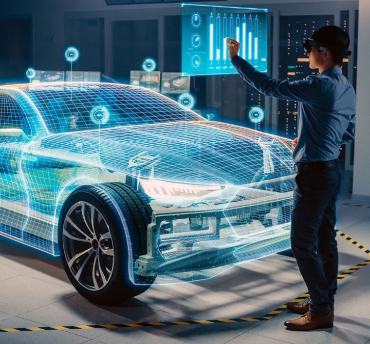 An engineer using Virtual Reality (VR) goggles to design a car