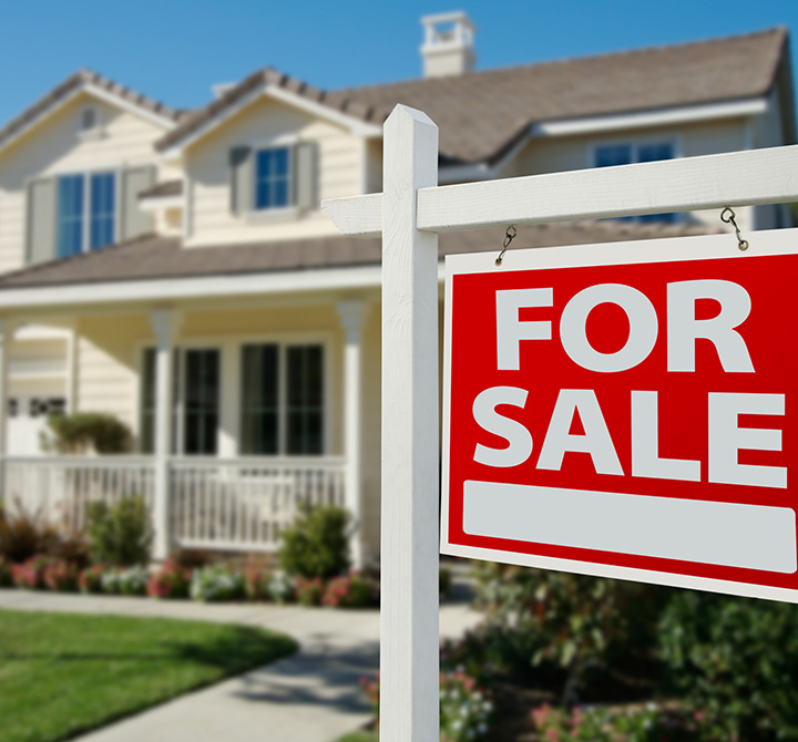 For sale sign outside house