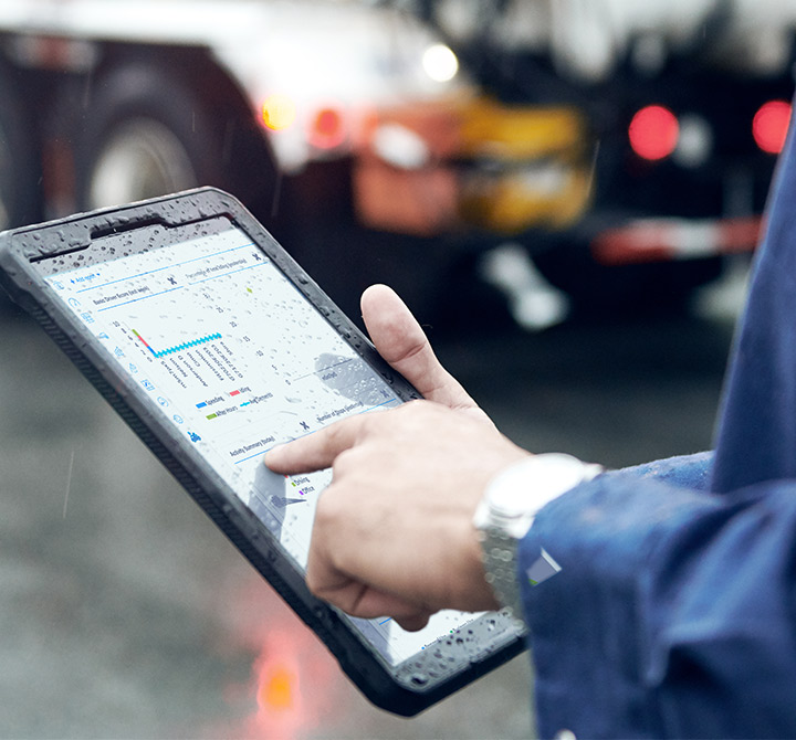Man on tablet in rain