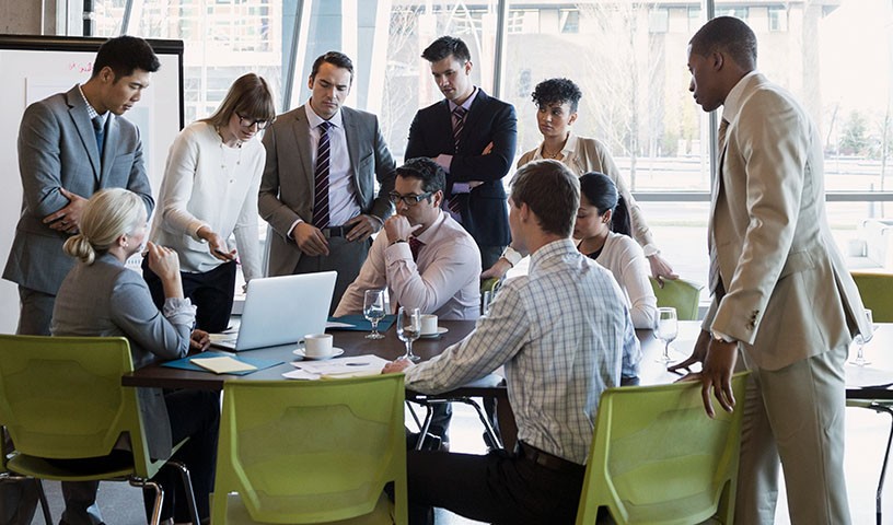 Team of professionals collaborating in a workplace conference room
